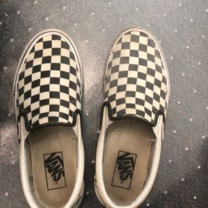 Checkerboard vans slip-on’s